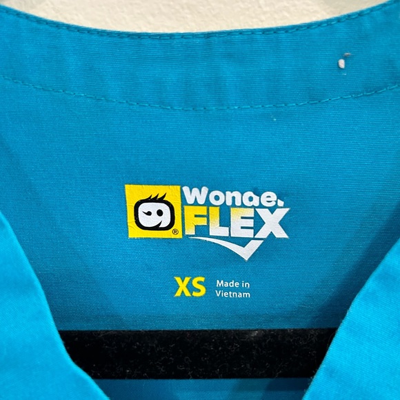 Two sets of Women’s Scrubs in Gray and Pink. Extra women’s scrub top included! - Picture 11 of 12